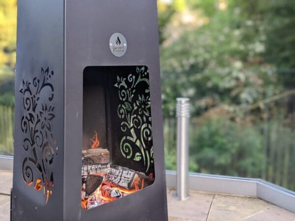 Luxury Metal Chimenea close up with trees in back ground