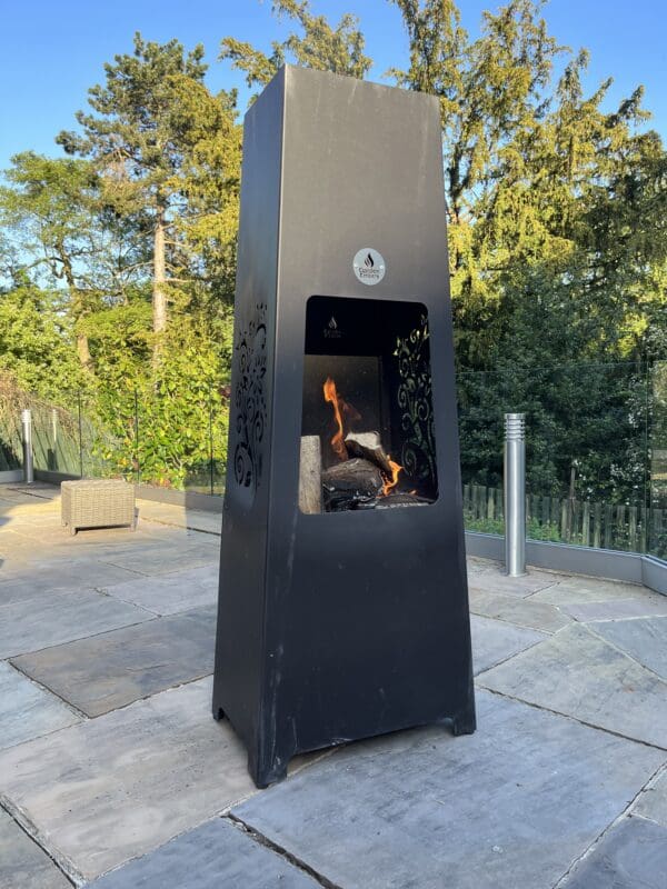 Luxury Metal Chiminea whole with trees in background portrait
